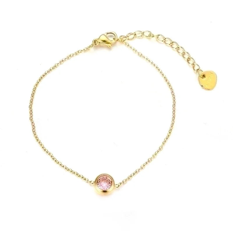 Gouden armbandje met gekleurd steentje roze