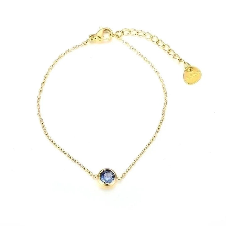 Gouden armbandje met gekleurd steentje blauw