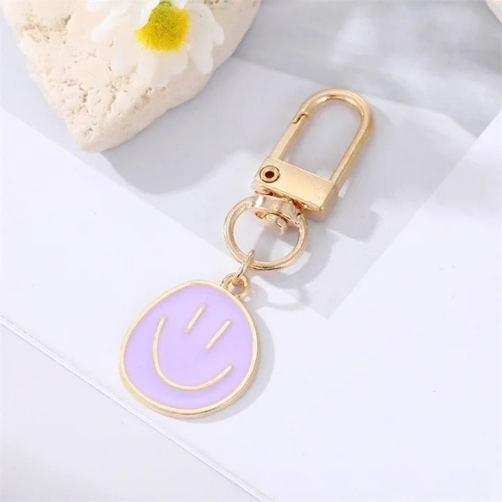 Smiley sleutelhanger paars