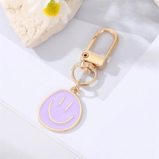 Smiley sleutelhanger paars
